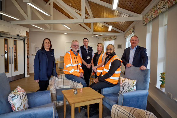 Staff in the newly refurbished communal lounge at Cedar House