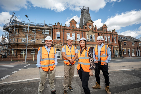 Representatives from RE:GEN and Thirteen Group outside building in Hull