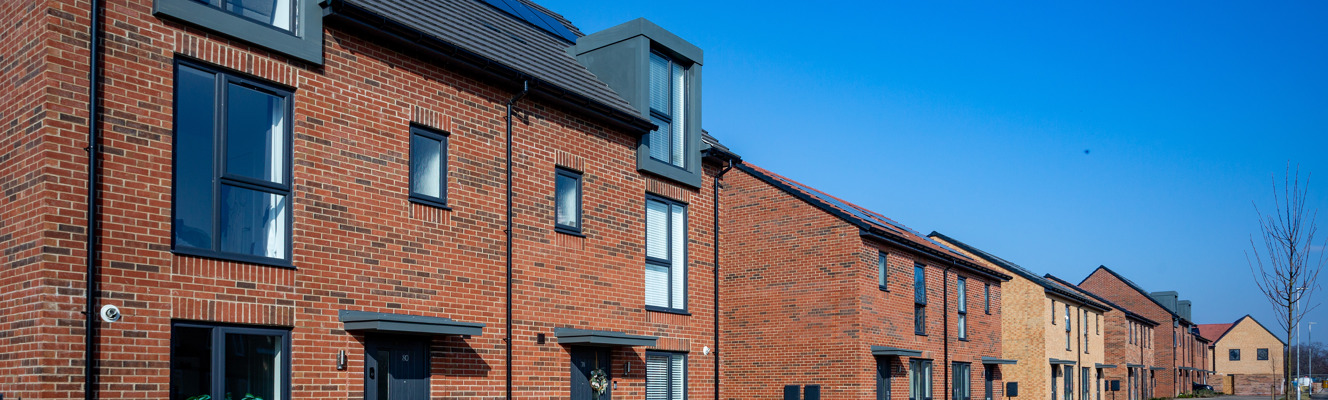 A row of new semi-detached family homes on a sunny day at Hillside Gardens