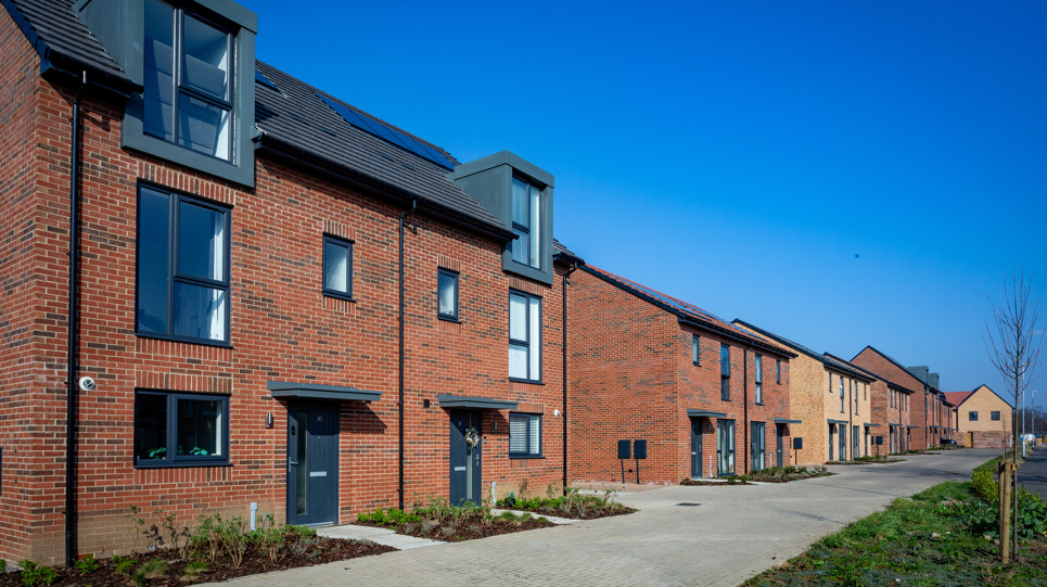 A row of new semi-detached family homes on a sunny day at Hillside Gardens