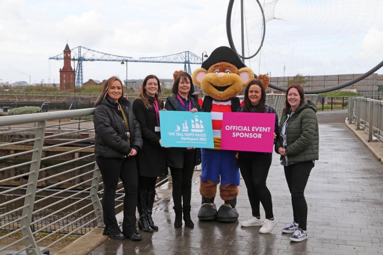 Members of the community resilience team, with the tall ships team and monkey mascot at the Middlesbrough Dock