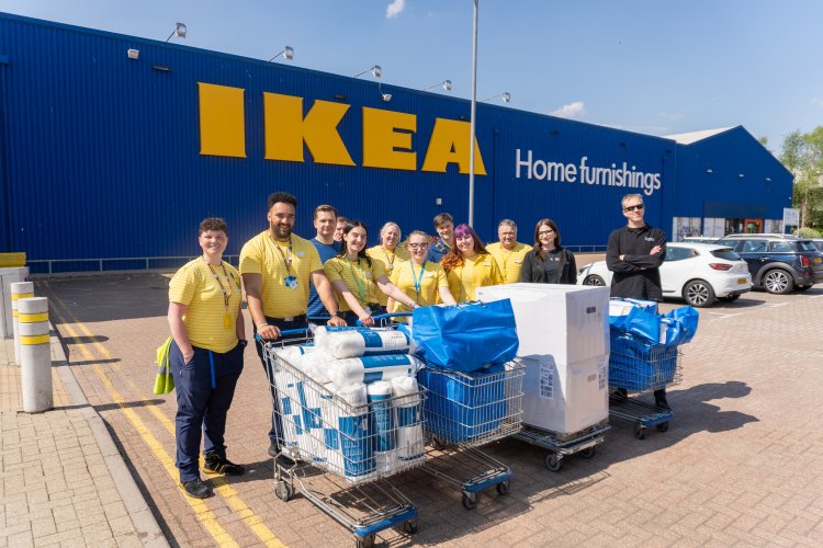 Members of staff from IKEA and Thirteen outside of IKEA with the donated sleep packs 